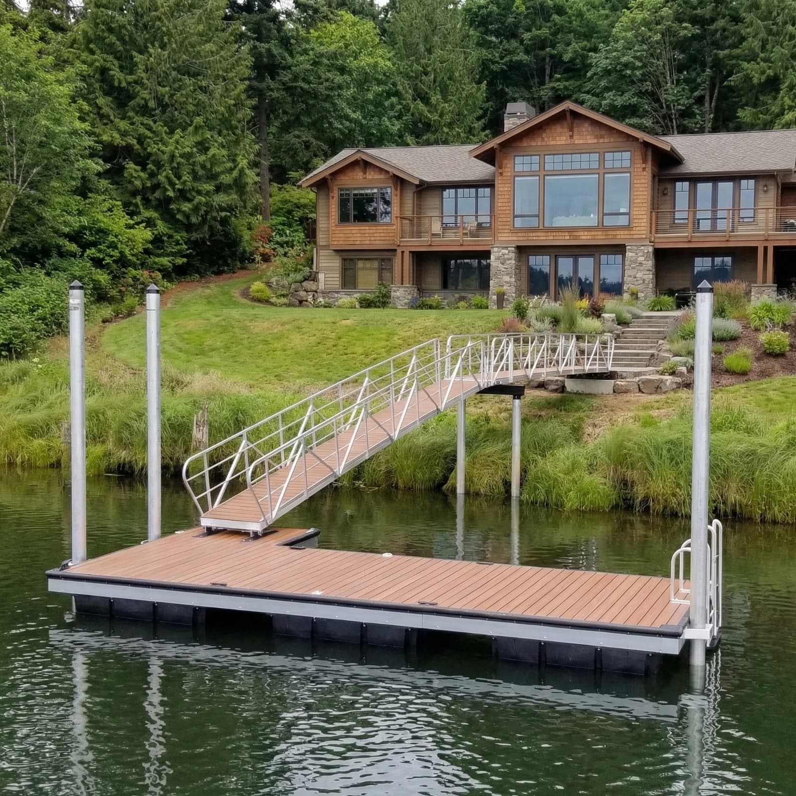 Craftsman home with aluminum gangway and floating dock